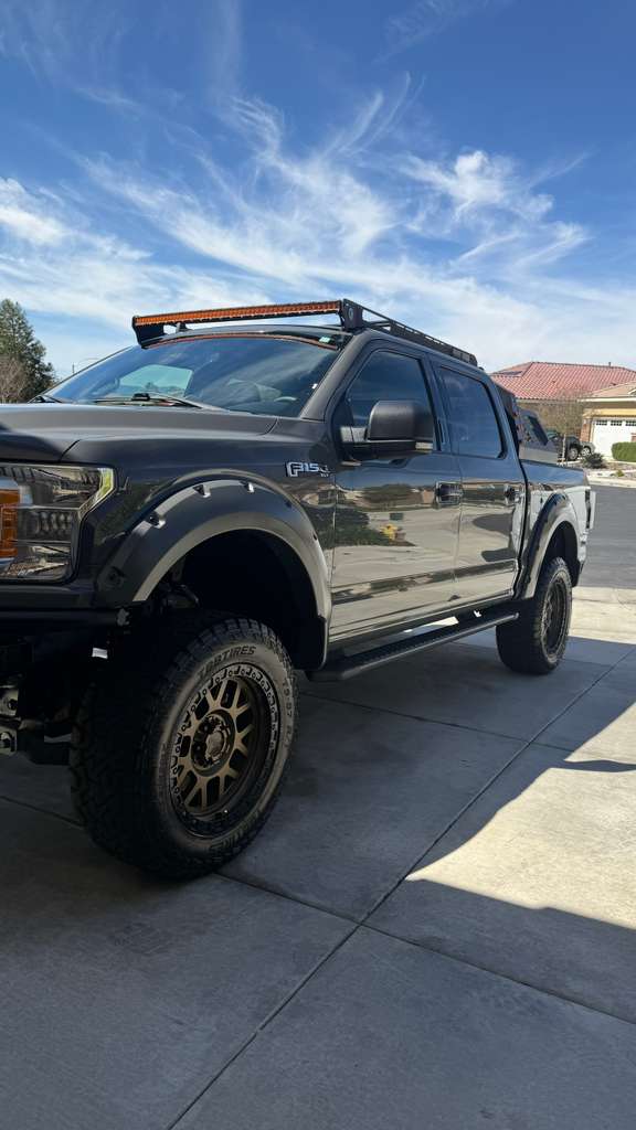 Exterior truck detailing in Riverside & San Diego County — lifted pickup truck with off-road wheels, detailed in a driveway