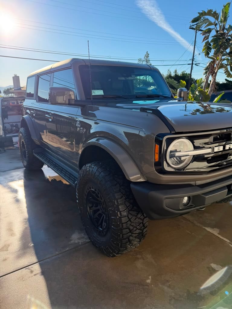 SUV mobile detailing in Riverside & San Diego County, off-road SUV with cleaned wheels and detailed bodywork in a driveway