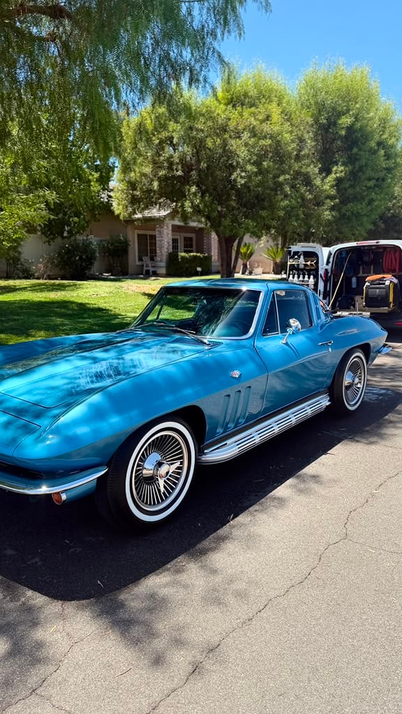 Classic car detailing in Riverside & San Diego County, classic sports coupe with a mirror-gloss finish and polished chrome wire wheels, detailed in a residential driveway