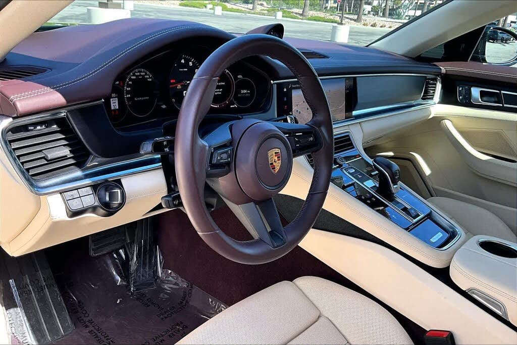 Interior car detailing in Riverside & San Diego County — cleaned cabin with two-tone leather seats, steering wheel, and centre console