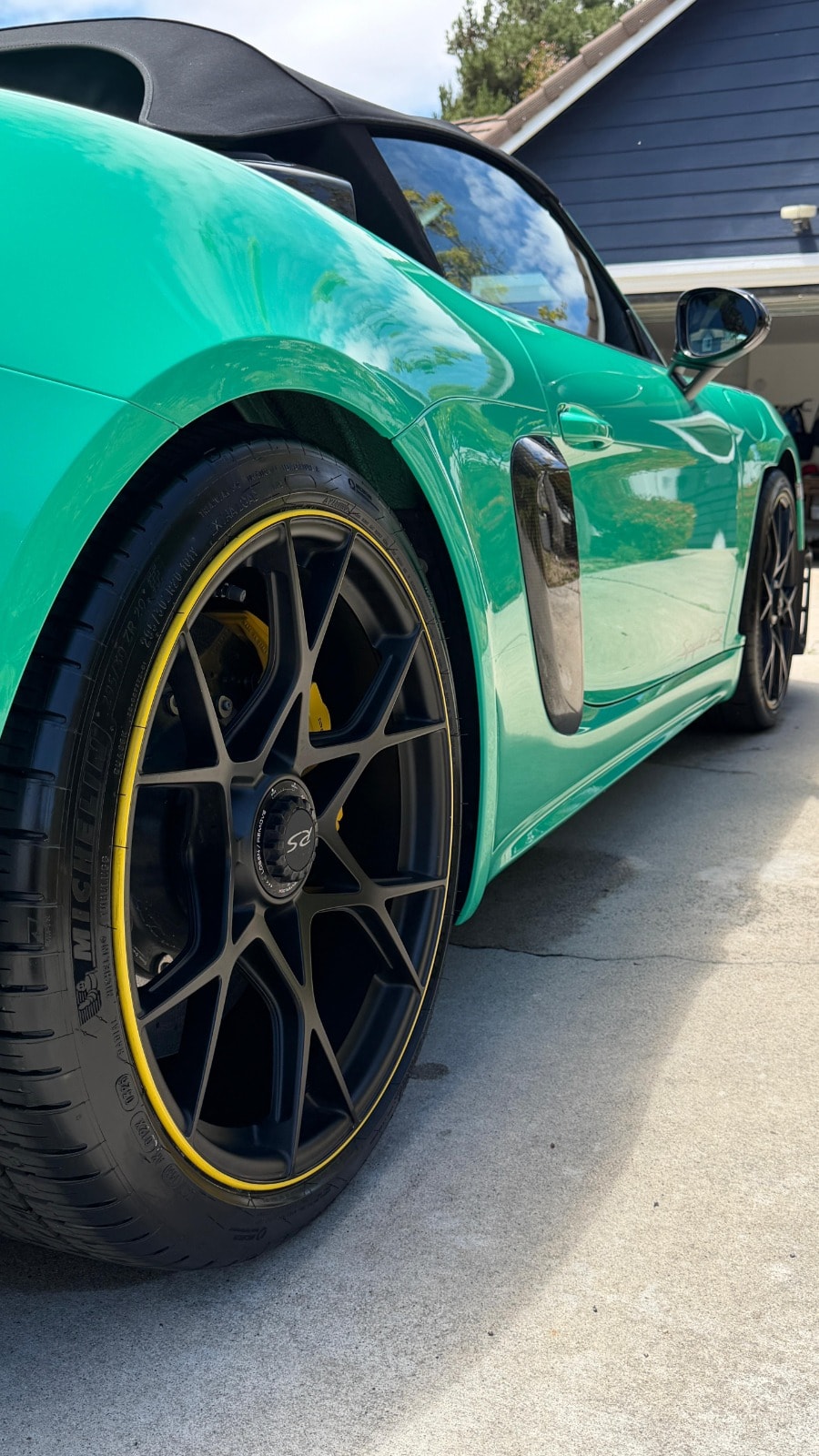 Wheel and paint detailing in Riverside & San Diego County — close-up of a cleaned wheel and reflective paintwork