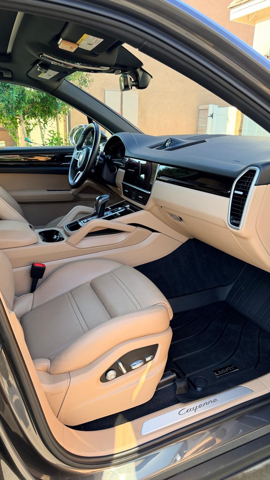 Interior car detailing in Riverside & San Diego County — detailed SUV dashboard, vents, and front seats in tan leather